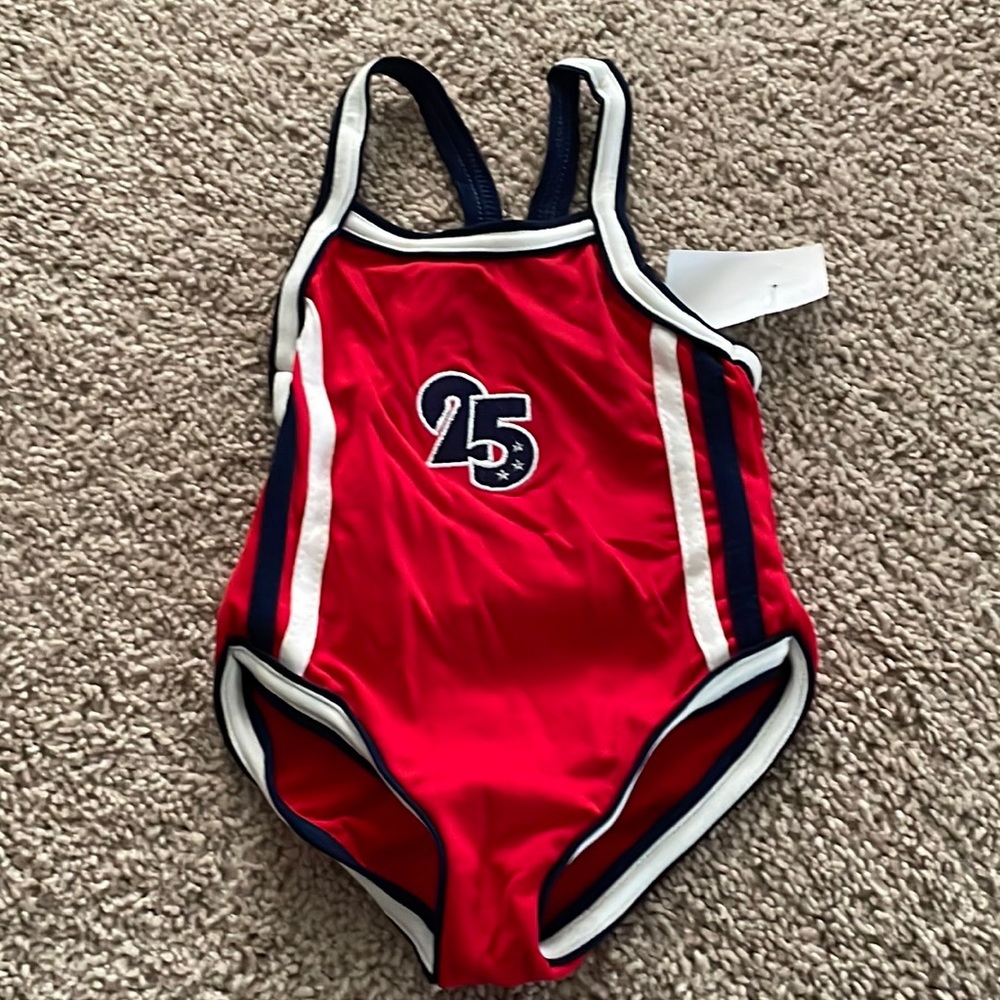 NWT girls size 3T swimsuit 1 price it is red, white & blue with # 25 & Stars
